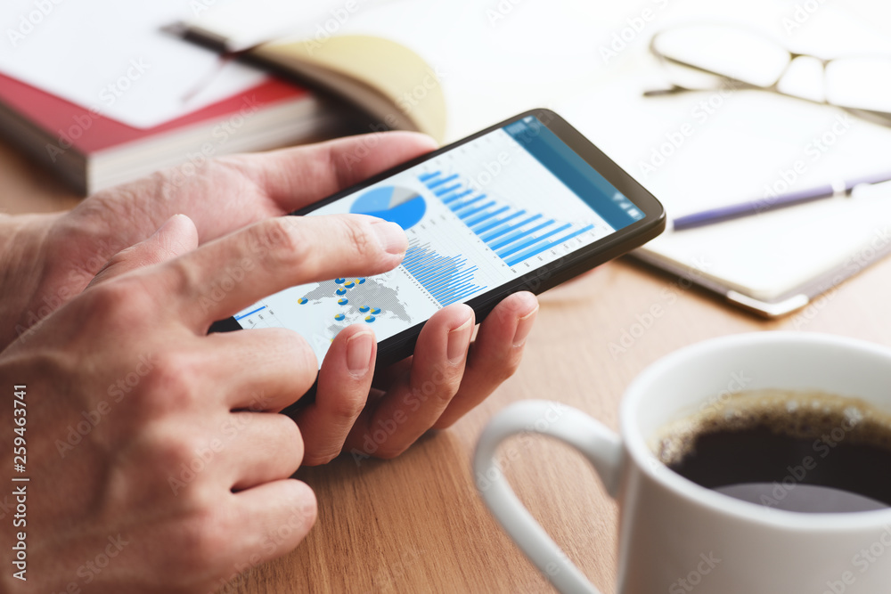 Aufkleber business intelligence concept. businessman using smartphone for analysis.smartphone and many graphs.