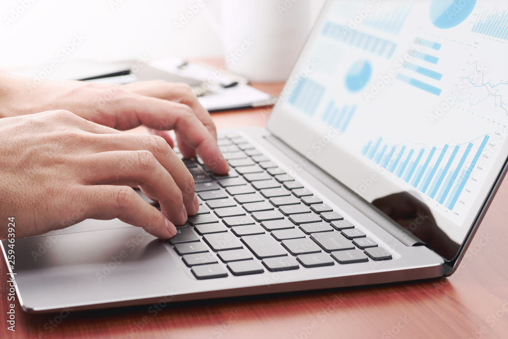Poster business analytics concept. businessman preparing reports.laptop and many graphs.