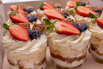 cupcakes with berries and cream