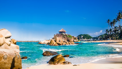 Beautiful bay with white sand beach and blue water in Tayrona national park in Colombia