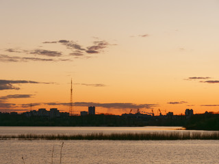 clouds float over the city in the evening.