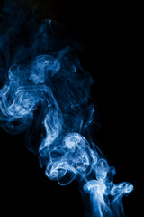 Blue smoke on black background