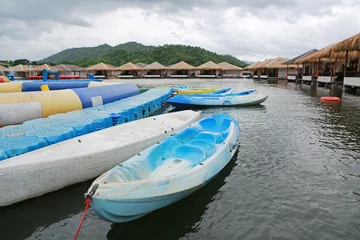 Foto op Canvas Boats on river at the raft in river kwai at kanchanaburi, Resort in thailand. © zilvergolf
