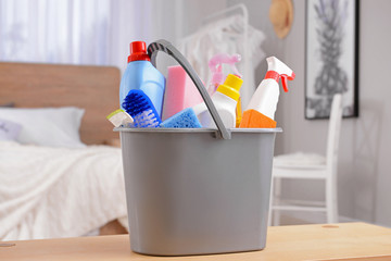 Set of cleaning supplies on table in flat