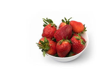 Strawberry in a bowl on a white background