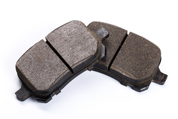 Set of brake pads, car spares isolated on white background