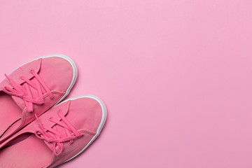 Pink shoes on a pastel background. Top view. Free space for text.