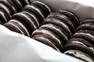 Box with tasty chocolate cookies, closeup
