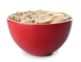 Bowl with tasty sweet oatmeal on white background