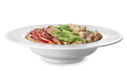 Plate with tasty sweet oatmeal on white background