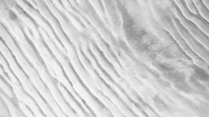 Fototapeta na wymiar Aerial top view, The surface of the sand beach background ,Wallpaper