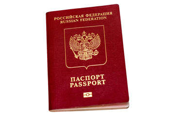 Red biometric passport of a Russian citizen isolated on white background, close-up. Inscription - Russian Federation, Passport. Border crossing, travel, immigration concept