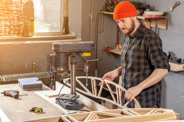 Construction Worker Using Drill To wood. Drill machine on the table in renovation work at home. Home repair concepts, close up.