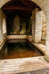 Fototapeta premium Holy spring in Lyadovsky rocky monastery, Ukraine