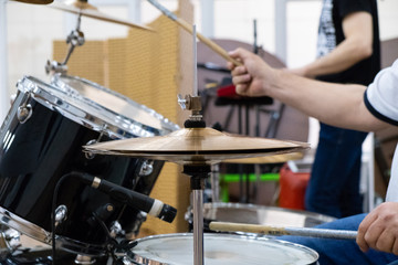 Fototapeta na wymiar Drummer playing his kit. Drums close up
