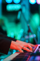Speech by musicians on stage. Hands and musical instrument closeup. 