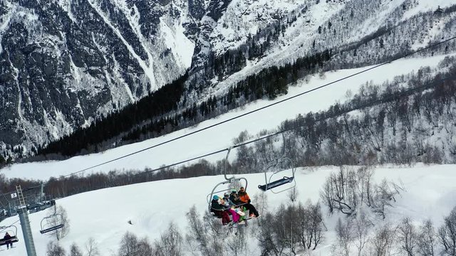 A person is freeriding on the snowboard down the hill, stunning mountain on the background