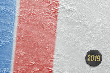 Fragment of ice hockey arena, puck, blue and red line