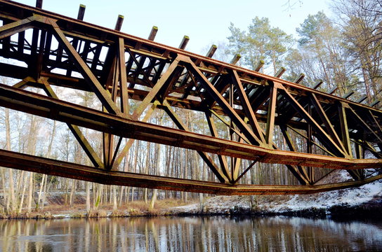 Bridge in the forest over the Gwda River in Poland. Build in 1914, destroyed at the end of World War 2 by German army.