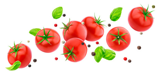 Falling tomatoes salad isolated on white background with clipping path, flying fresh vegetables ingredient