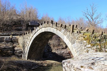 Fototapeta na wymiar The old stone bridge of Capetan Arkouda at Zagorochoria at the region of Ioannina in Epirus Greece