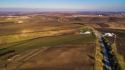 Aerial view of suburban road between fields. Moldova republic of.