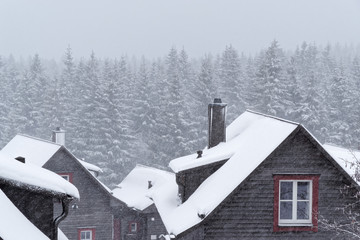 Snow covered roof of a wood house in Harz mountains, Germany