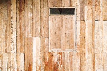Old wooden walls and old wooden windows for the background, Wall of an old wooden house.