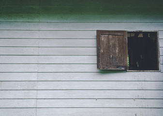 Fototapeta na wymiar White wooden walls and old wooden windows for the background, old wooden window on a wall.