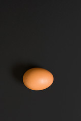 Eggs at black background top view. Copy space for text concept.