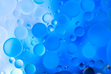 water drops on glass with blue background, close-up 