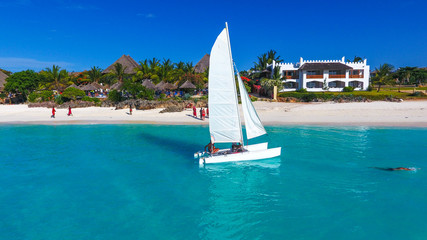 White sailboat in a sea  Zanzibar Beach. Aerial view