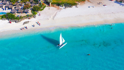 White sailboat in a sea  Zanzibar beach aerial view