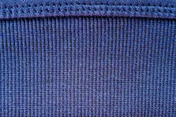 Texture of blue wool fabric with stitching close-up shot