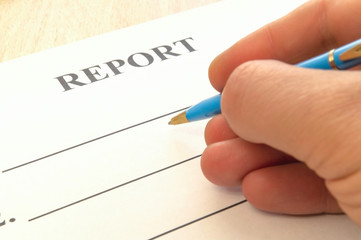 We are preparing a report - a form to fill in on a rustic table.