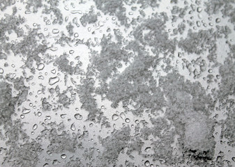 Obraz premium melting snow on the glass. sleet on glass