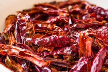 Stack of Dried Red Chili or Chilli Cayenne Pepper in Bowl.