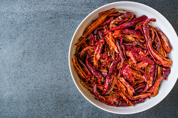 Fototapeta premium Stack of Dried Red Chili or Chilli Cayenne Pepper in Bowl.