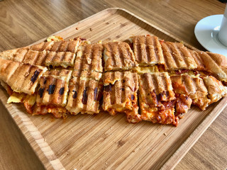 Turkish Toast Cut into Pieces /Fried Sandwich Tost Slices on Wooden Plate.
