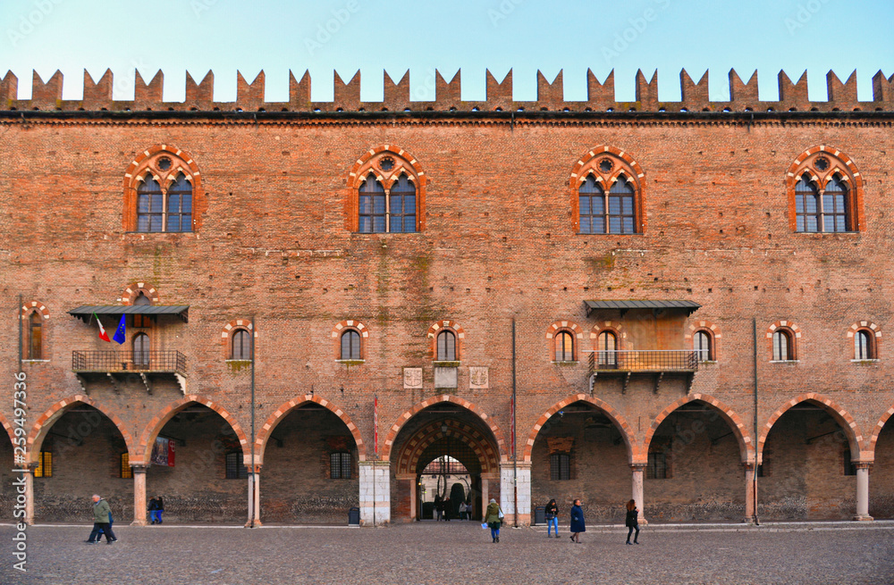 Wall mural view of piazza sordello with people and detail of facade of palazzo ducale building , mantua, lombar