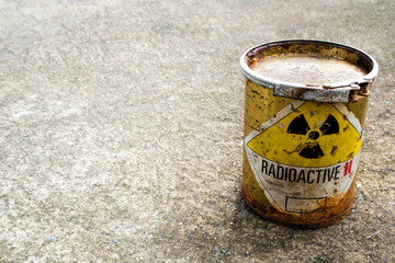 Rusty package of radioactive material container on the rough concrete floor