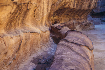 Water channel in so called Siq passage in ancient Petra city in Jordan