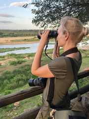Girl with binoculars on safari