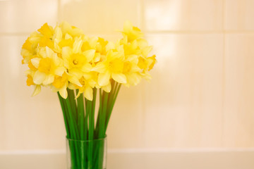 Bunch of daffodils in a crystal glass vase
