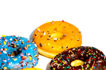 Sweet tasty donuts with colorful sprinkles isolated on white background