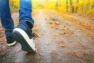 young man walking in the forest