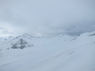 winter mountain landscape with mountains and fog sky