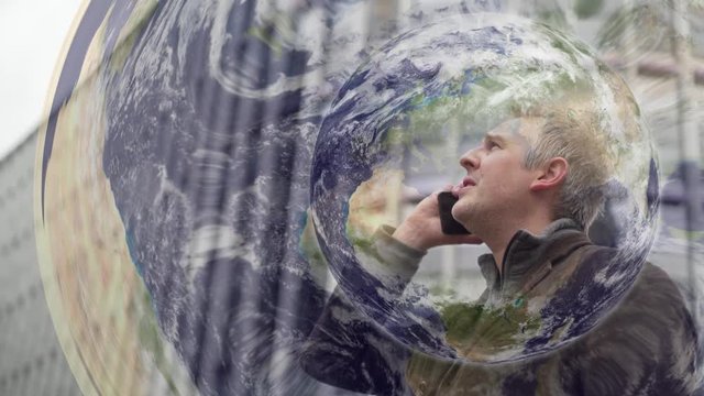 Man on a phone talking to anywhere in the world.