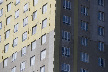  Exterior house wall heat insulation with mineral wool, building under construction.