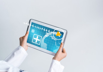 Close of female doctor hands working with tablet pc computer